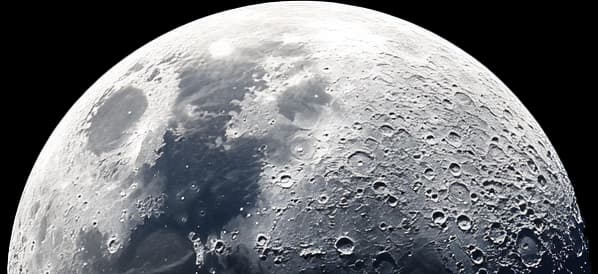 The moon's surface showing detailed craters and textures.